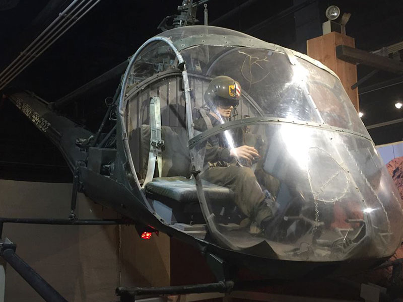 Museum exhibit with one Army Soldier in an aircraft vehicle.